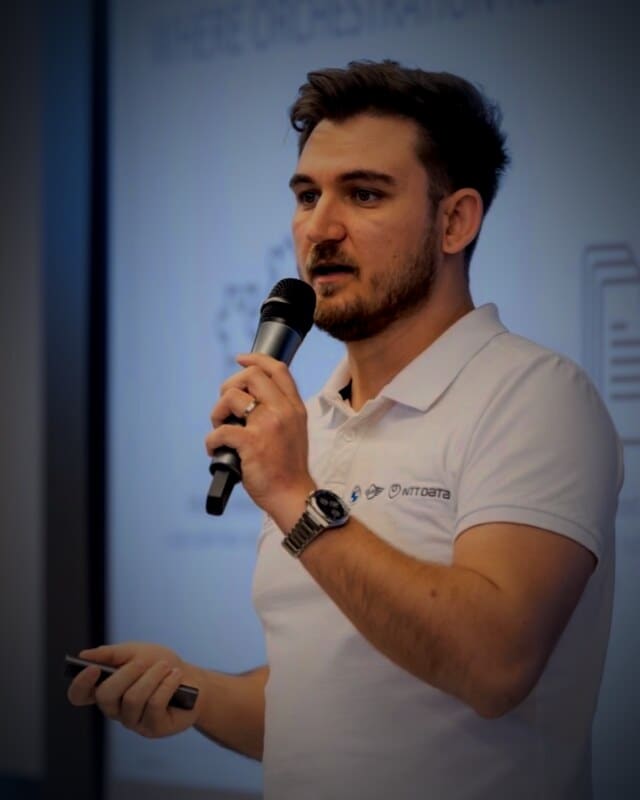 Edward Vlad, Angular Tech Lead and Systems Architect, speaking at a tech conference